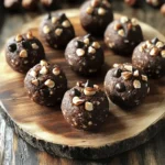 - Raw hazelnuts - Rolled oats - Unsweetened cocoa powder - Natural peanut butter or almond butter - Pure maple syrup or honey - Chocolate protein powder - Dark chocolate chips (optional) These key ingredients help make the perfect Chocolate Hazelnut Protein Bites. The raw hazelnuts provide a rich, nutty flavor. I love roasting them to bring out their taste. Rolled oats add texture and fiber, making these bites filling. Unsweetened cocoa powder gives a deep chocolate flavor without extra sugar. Natural peanut butter or almond butter adds creaminess and healthy fats. I often switch between them based on my mood. Pure maple syrup or honey acts as a sweetener. They add a natural sweetness to the bites. Chocolate protein powder boosts the protein content, making these bites a great snack after a workout. I sometimes add dark chocolate chips for a touch of extra sweetness and a little indulgence. Feel free to adjust the ingredients to match your taste! Check out the Full Recipe for detailed instructions. To start, roast the hazelnuts. Preheat your oven to 350°F (175°C). Spread the hazelnuts evenly on a baking sheet. Roast them for 10-12 minutes. Watch for a nice scent and a light golden color. After roasting, let them cool completely. Once cooled, chop them finely. You can do this by hand or use a food processor. Next, it's time to mix the dry ingredients. In a large bowl, combine the ground hazelnuts, rolled oats, cocoa powder, chocolate protein powder, and salt. Stir everything well. This ensures each bite will have a balanced flavor and texture. Now, let’s combine the wet ingredients. In a separate bowl, add the peanut butter and maple syrup. You can also use almond butter if you prefer. Add in the vanilla extract too. Mix these until they are smooth and creamy. This step is key for a nice, rich taste in your bites. Pour the wet mixture into the dry ingredients. Use a spatula or spoon to stir until well combined. If you like chocolate chips, now's the time to fold them in gently. This adds a delightful burst of chocolate flavor. Now, shape the mixture into bites. Use a tablespoon or a small cookie scoop to scoop portions out. Roll each portion into small balls with your hands. Place them on a parchment-lined baking sheet. Make sure to space them out so they do not stick together. Finally, chill the bites. Place them in the fridge for at least 30 minutes. This helps them firm up. Once chilled, they are easier to enjoy. You can find the full recipe for Chocolate Hazelnut Protein Bites [Full Recipe]. To get the smoothest texture for your protein bites, start with roasted hazelnuts. The roasting brings out their rich flavor and makes them easier to blend. After roasting, let them cool. Then chop or pulse them in a food processor until they are coarsely ground. This will help them mix well with the oats and cocoa powder. When you mix wet and dry ingredients, make sure to blend them thoroughly. A well-mixed batter helps create a consistent bite. If you want an even creamier texture, try adding a bit more nut butter. Just don’t go overboard, or they may become too sticky. For a lovely presentation, arrange the protein bites on a small, colorful platter. You can sprinkle some chopped hazelnuts on top for added flair. This simple touch brings a nice crunch and elevates the look. You can also serve them in decorative cupcake liners. This makes each bite feel special. For a fun twist, pair them with fresh fruit or yogurt. These treats make a great snack for parties or a quick post-workout boost. Everyone will love their taste and presentation! If you want to mix things up, consider adding a pinch of cinnamon or nutmeg for warmth. These spices enhance the chocolate and hazelnut flavors beautifully. You can also add a tablespoon of chia seeds or flaxseeds for extra nutrition. If you enjoy a bit of saltiness, try a sprinkle of sea salt on top. For a more indulgent flavor, some people like to add a few drops of orange extract. This gives a bright and zesty kick. Feel free to experiment and make the bites your own! For the full recipe, check out the section above. {{image_4}} If you want a nut-free version, use sunflower seed butter. This swap gives you a similar creamy texture. It also keeps the bites delicious and safe for those with nut allergies. Just replace the nut butter in the recipe with an equal amount of sunflower seed butter. The flavor will change slightly, but it still tastes great! To make these bites vegan, you can replace honey with agave syrup or maple syrup. Choose a plant-based protein powder instead of whey. Both changes help create a tasty, vegan treat. You won’t lose any flavor or texture! You can change up the flavors easily. Adding spices like cinnamon or nutmeg can give a warm taste. Another option is to mix in extracts, such as almond or peppermint. These small changes can make your protein bites feel fresh and exciting every time you make them. For the full recipe, check out the complete instructions and enjoy these tasty snacks! Store your Chocolate Hazelnut Protein Bites in an airtight container. The fridge is perfect for keeping them fresh. Just place the bites in a single layer to avoid sticking. For longer storage, the freezer works great. Wrap each bite in plastic wrap, then put them in a freezer bag. This way, they stay tasty for later. In the fridge, these bites last about one week. If you freeze them, they can stay good for up to three months. Just remember to label your container with the date. This helps you know how long they have been stored. To enjoy your bites after storing, take them out of the fridge or freezer. If they are too hard, let them sit at room temperature for a few minutes. You can also microwave them briefly for a warm treat. Just heat them for about 10-15 seconds. This softens them nicely without melting away the flavor. Chocolate hazelnut protein bites can last up to one week in the fridge. To keep them fresh, store them in an airtight container. If you want to keep them longer, you can freeze them for up to three months. Just remember to let them thaw in the fridge before enjoying. Yes, you can make these bites without protein powder. Just increase the oats or add nut flour for texture. The bites will still taste great, but they will have less protein. You can also add more hazelnuts or seeds for protein boost. If you cannot find hazelnuts, you can use almonds or walnuts. Both nuts provide a nice crunch and taste. You can also try sunflower seeds for a nut-free option. Just remember, the flavor will change a bit with different nuts. Yes, these protein bites are great for kids. They are tasty and packed with healthy ingredients. Just make sure to check for any nut allergies before serving. Kids love sweet treats, and these bites give them a healthy option. Absolutely! You can use honey or agave syrup as a sweetener. Both options work well and add a nice flavor. If you want a low-calorie option, try stevia or monk fruit sweetener. Just adjust the amount to taste. You can enjoy 2-3 protein bites as a snack each day. They are healthy and satisfying. Just pay attention to your overall diet and activity level. If you are active, you may want more for energy. These chocolate hazelnut protein bites are easy to make. We covered key ingredients like hazelnuts, oats, and cocoa powder. I explained how to prepare, mix, and chill them for the best taste. You can customize flavors and use nut-free options too. In the end, these bites are perfect for a healthy snack. They taste great and are simple to store. Make them your own and enjoy!