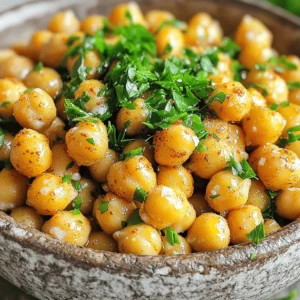 - 1 can (15 oz) chickpeas - 2 tablespoons extra virgin olive oil - 1 teaspoon smoked paprika - 1 teaspoon garlic powder - 1 teaspoon ground cumin - Sea salt and freshly ground black pepper - 1 tablespoon nutritional yeast - Fresh parsley for garnish Crispy chickpeas are a great snack. They are easy to make and pack great flavor. You only need a few ingredients. The main ingredient is chickpeas. I love using canned chickpeas because they are quick and ready to use. Next, you need olive oil. It helps make the chickpeas crispy and adds flavor. The spices bring the magic. Smoked paprika gives a nice smoky taste. Garlic powder adds a savory touch. Ground cumin gives a warm flavor that blends well. To finish, I like to add sea salt and black pepper. These simple seasonings make a big difference. If you want a cheesy flavor, add nutritional yeast. It’s optional but very tasty. Lastly, garnish with fresh parsley. It adds a pop of color and freshness. This simple ingredient list makes crispy chickpeas a fun and tasty treat. You can enjoy them on their own or add them to salads and bowls for extra crunch. - Preheat oven to 400°F (200°C). - Prepare the baking sheet by lining it with parchment paper. - Drain and rinse chickpeas in a colander. - Pat chickpeas dry with paper towels. This step is key to getting them crispy. - Coat chickpeas with two tablespoons of olive oil. Toss them to coat well. - In a bowl, mix smoked paprika, garlic powder, ground cumin, sea salt, and black pepper. - Sprinkle the seasoning over the oil-coated chickpeas. Toss again until evenly coated. - Spread the seasoned chickpeas in a single layer on the baking sheet. - Bake for 25-30 minutes. Halfway through, shake the pan for even crisping. - Once golden brown, take them out and let them cool slightly. - Garnish with fresh parsley before serving. These crispy chickpeas are ready to enjoy! For the full recipe, check the details provided earlier. To get crispy chickpeas, start by drying them well. After draining and rinsing your chickpeas, use paper towels to remove moisture. This step is key. The drier the chickpeas, the better they will crisp up. Next, select the right oil. I recommend extra virgin olive oil. It adds flavor and helps the spices stick. Other oils can work too, but olive oil is my favorite for taste. You can bake your chickpeas, but air frying is faster. An air fryer gives you that crunch in less time. Just toss them in your air fryer and set it to 400°F. In about 15-20 minutes, you’ll have a tasty snack. If you prefer a different texture, try pan-frying. Use a skillet with some oil on medium heat. Stir often until they turn golden brown. This method gives a nice crunch, but it requires more attention. Spices make a big difference in flavor. I love to mix smoked paprika, garlic powder, and cumin. You can also try cayenne for heat or Italian herbs for a twist. For a cheesy taste, add nutritional yeast. It gives a savory flavor that pairs well with the chickpeas. Sprinkle it on after they bake for an extra layer of taste. For more details on making crispy chickpeas, check out the Full Recipe. {{image_4}} You can change the taste of crispy chickpeas easily. For a spicy kick, use cayenne pepper. Just add a pinch or more to your spice mix. This gives a nice heat that many enjoy. If you want a herby flavor, try Italian seasoning. Mix it into the spice blend. The herbs add a fresh and lively taste to your chickpeas. Crispy chickpeas make a great salad topping. They add crunch and flavor. Just sprinkle them on your favorite salad for a tasty twist. You can also pair them with dips like hummus. Their crispy texture contrasts well with the smooth dip. It’s a fun and tasty way to enjoy them. You can add crispy chickpeas to grain bowls. They provide a tasty source of protein and crunch. Mix them with rice, quinoa, or farro for a satisfying meal. They also work well in roasted vegetable dishes. Just toss them in with your veggies. You’ll get a crunchy surprise in each bite. For the full recipe, check out the Crispy Chickpeas Delight. Enjoy your cooking! To keep your crispy chickpeas fresh, use an airtight container. Glass containers work great for this. You can also use plastic containers with secure lids. Make sure to let the chickpeas cool completely before sealing them. This helps prevent moisture build-up. For the best taste, enjoy your crispy chickpeas within three days. They will stay crispy and delicious during this time. After three days, they may become soft. If you need a longer shelf life, consider storing them in the fridge for up to a week. When reheating crispy chickpeas, the oven is your best friend. Preheat it to 350°F (175°C). Spread the chickpeas on a baking sheet in a single layer. Heat them for about 10 minutes. This method helps them stay crunchy. Avoid using the microwave. It can make your chickpeas soggy. If you have an air fryer, that's another great option. Just a few minutes in the air fryer can restore their crispiness. Enjoy your snack! You can use an air fryer to make crispy chickpeas without oil. An air fryer cooks by circulating hot air. This method keeps the chickpeas crispy and reduces fat. - Drain and rinse your chickpeas as usual. - Pat them dry with paper towels. - Season the chickpeas with spices you love. - Place them in the air fryer basket. - Cook at 400°F for about 15-20 minutes. - Shake the basket halfway through for even cooking. You can also roast chickpeas in the oven without oil. Just follow the same steps, but use parchment paper to keep them from sticking. You might need to bake them a bit longer for crispiness. Yes, you can use dried chickpeas! Dried chickpeas need more time to prepare, but they can taste better. - Start by soaking the dried chickpeas overnight. This softens them. - Drain and rinse the soaked chickpeas. - Boil them in water for about 1-2 hours until tender. - Once cooked, follow the same steps as with canned chickpeas for seasoning and baking. Using dried chickpeas can give a fresher taste to your crispy snack. Crispy chickpeas are a great snack for health! They are high in protein and fiber. - One serving has about 120 calories. - They contain iron, magnesium, and vitamin B6. Chickpeas can help with digestion and keep you full longer. They are also low in fat, making them a smart choice. Snacking on crispy chickpeas can be a healthy way to satisfy cravings. You can enjoy them guilt-free! Crispy chickpeas are easy and fun to make. We talked about key ingredients like chickpeas and spices. I showed you how to prep, season, and bake them for the best crunch. Plus, we explored tips for extra flavor and different cooking methods. Remember, you can store leftovers in an airtight container to keep them fresh. Enjoy adding crispy chickpeas to salads, bowls, or as a snack. With so many ways to enjoy them, I hope you feel inspired to cook this tasty treat!